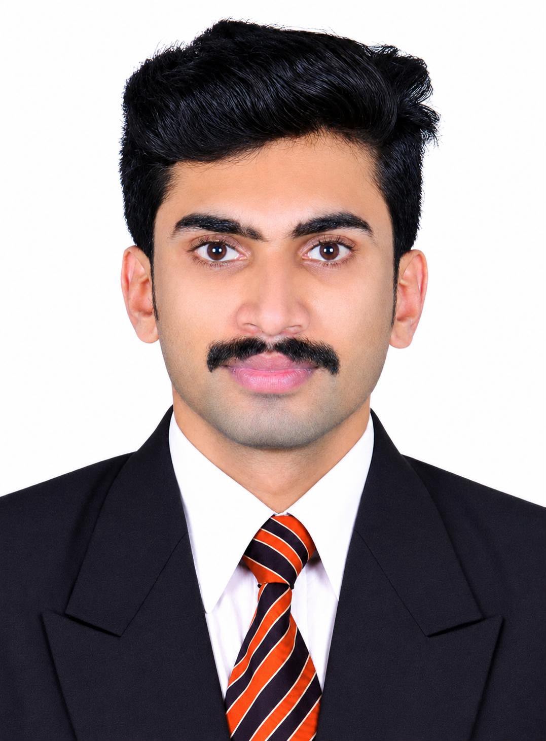 Adharsh KS wearing a suit